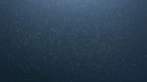 Dust particles in a ray of light against dark background Stock Footage 90501250