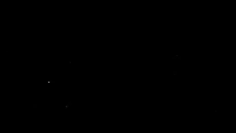Dust particles sparkling on black background with white light bokeh effect Stock Footage 138098592