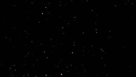 Dust particles sparkling on black background with white light bokeh effect Stock Footage 138098687