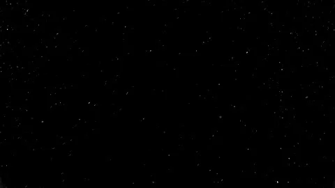 Dust particles sparkling on black background with white light bokeh effect Stock Footage 138100542
