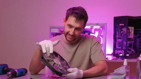 Dust removal from electronic components. Delicate maintenance of computer fan Stock Footage 347877574