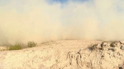 Dust rises when a helicopter lands in the desert, clouds of sand fly into the ai Stock Footage 79688810