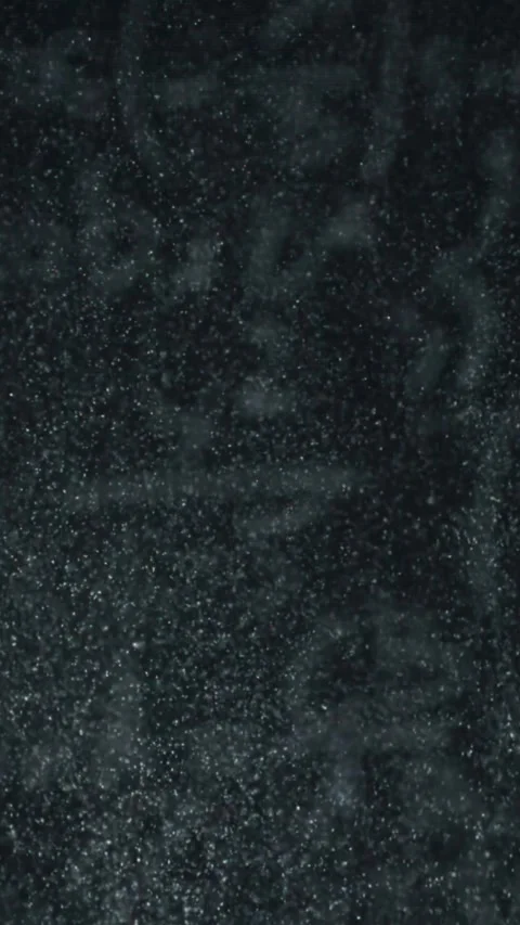 Dust from school chalk against the background of the blackboard. Filmed on a Stock Footage 335381767