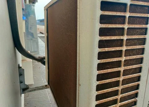 Dust sticks to the back of the compressor causing the air conditioner to no.. Stock Photos