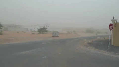 Dust storm in the Middle East blows sand across the road Stock Footage 131390309