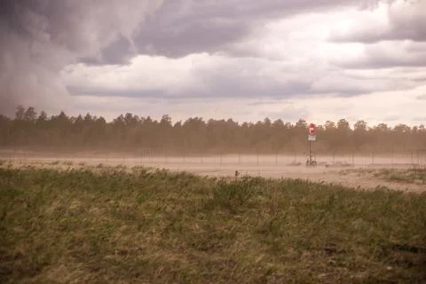 Dust storm in an open field in spring Stock Photos