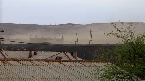 Dust storm over an half-abandoned village Stock Footage 100257395