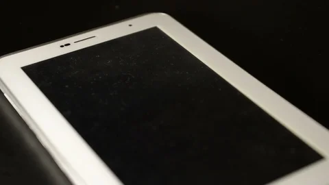 Dust on tablet Stock Footage 128580971