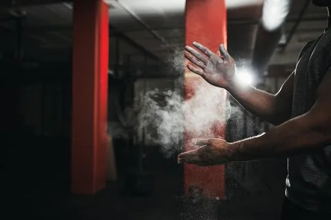Dust yourself off and try again. an unrecognizable man dusting his hands with Stock Photos
