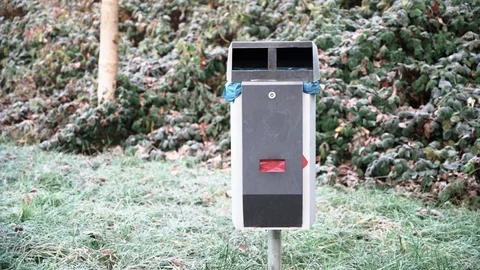 Dustbin on a dirt road on a cold winter morning Stock Footage 120955047