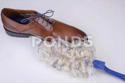 Duster dirty with brown business shoe Stock Photos