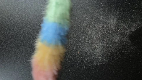 Dusting bread crumbs from table by static feather duster Stock Footage 121687718