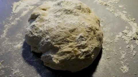 Dusting the Dough with Flour Close-up. Biscuit Dough, Flour, Eggs and Sugar. Stock Footage 231752753