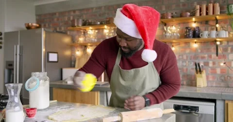 Dusting dough with flour, man is stamping leaf and circle shapes on kitchen Stock Footage 319779454