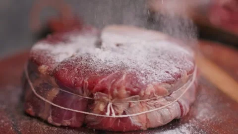 Dusting fresh Osso Buco steak with wheat flour. Close-up Video stock 311891942