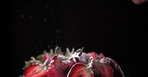Dusting icing sugar over delicious chocolate cake with dark background Stock Footage 55880147
