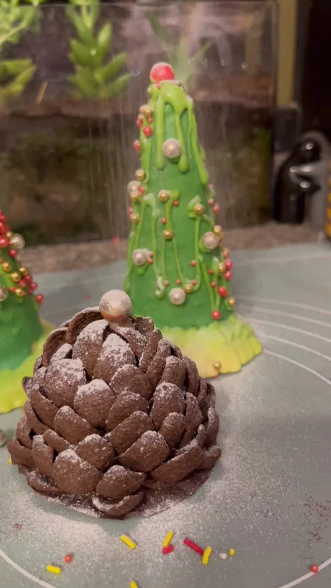 Dusting Powder Sugar on Chocolate Pine Cone Dessert Stock Footage 345307008