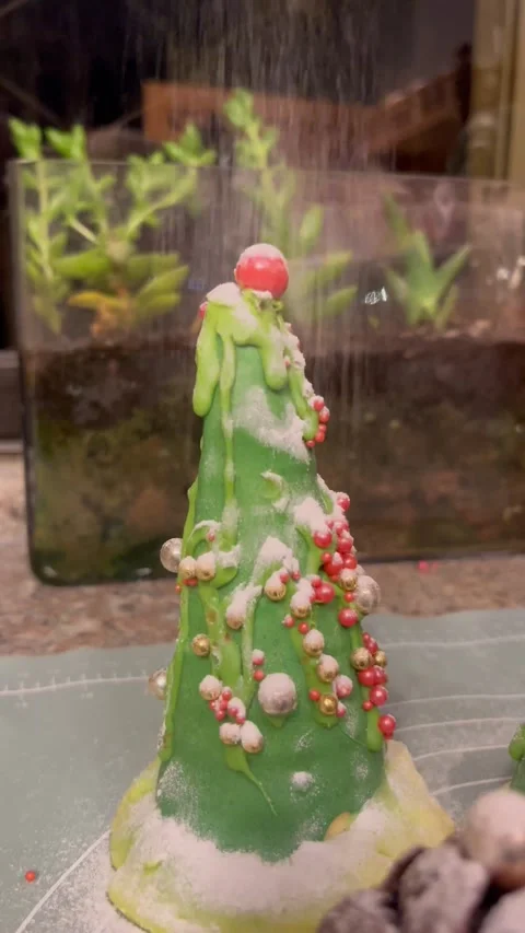 Dusting Powder Sugar on a Festive Christmas Tree Dessert Stock Footage 345307011