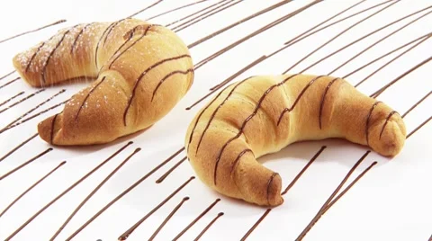 Dusting two croissants with icing sugar Stock Footage 8571176