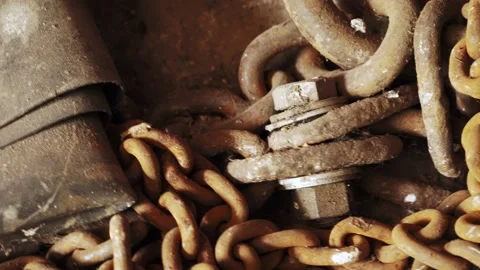 Dusty and rusty chains and rubber mats on garage floor Stock Footage 195999380