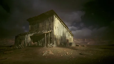 Dusty barn surrounded by desolation and distant threatening clouds Stock Footage 339796884