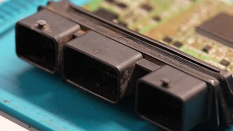 Dusty black plastic electrical connectors on automotive engine control unit. Stock Footage 344230841