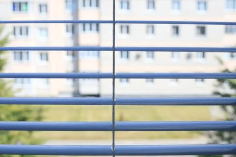 Dusty blue window blinds front view, dirty metal jalousie slats close up wi.. Stock Photos