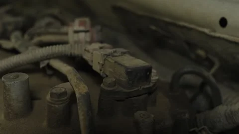A dusty camshaft position sensor mounted inside a car engine Stock Footage 339684707