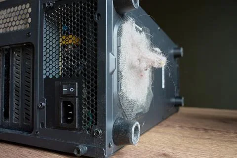 Dusty computer fan filter close up on PC case Stock Photos