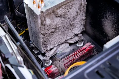 Dusty computer hardware with heat sink covered in grime inside a desktop case Stock Photos