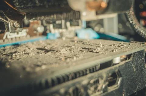 Dusty computer video card. A layer of dust and dirt on the PCB. Selective focus Stock Photos