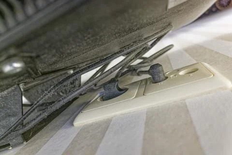 Dusty electronic device with tangled cables plugged into wall sockets on st.. Stock Photos