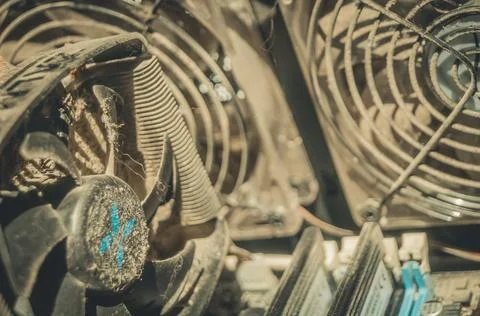 Dusty fan of the cooling system of the computer processor. Dirt on the fins of Stock Photos