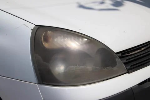 Dusty headlight from side. Stock Photos
