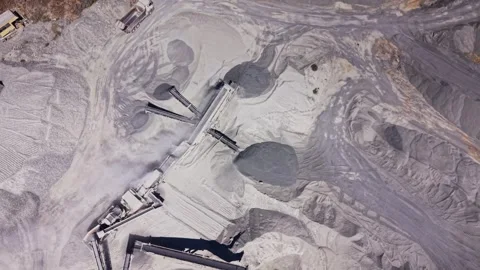 Dusty landscape of a large mining site shows machinery and piles Stock Footage 344538269