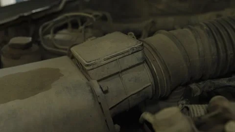 A dusty mass air flow sensor inside a car engine Stock Footage 339684826