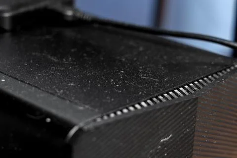 Dusty office computer with external memory drive on top close up 写真素材