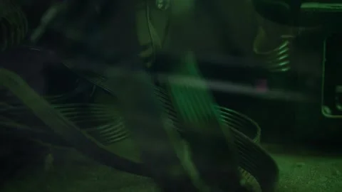 Dusty PC cables bend through computer case under green light. Macro view tangled Stock Footage 340326569
