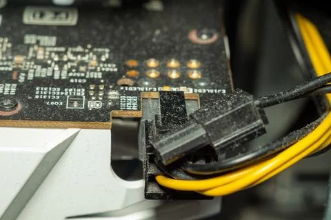 Dusty power connector plugged into a computer motherboard inside an old pc Stock Photos