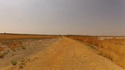 Dusty road drive Stock Footage 78359255