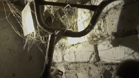 Dusty Rusty Old Bicycle Showing Wear and Restoration Potential in Garage Stock Footage 336278728