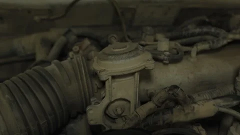A dusty throttle body assembly mounted on a car engine Stock Footage 339685836