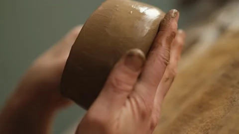 Dutch angle close up shot of ceramic artist sculpting bowl in the studio Stock Footage 236329260