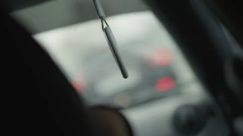 Dutch angle interior car cabin heart shaped handle hanging by window motion Stock-Footage 310517171