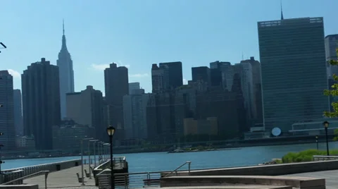 Dutch Angle Pan of NYC Skyline - Empire State Building, United Nations Stock Footage 32375506
