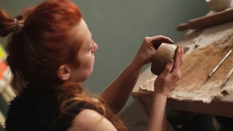 Dutch angle shot of ceramic artist making bowl in the studio Stock Footage 236372615