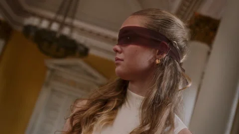 Dutch Angle Shot Of Dancer In Sheer Blindfold In Classical Hall Stock Footage 317996568