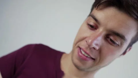 Dutch angle shot upset young man looking and shaking smartphone screen Stock Footage 208373459