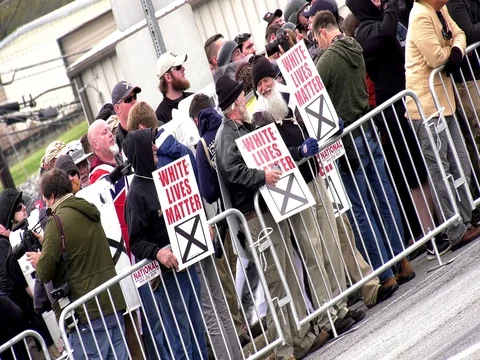 Dutch angle shot of White-supremacist rally Stock Footage 81664964