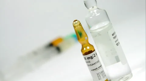 Dutch Angle On Vials And Syringes With Medicine, Rack Focus Stock Footage 47657359